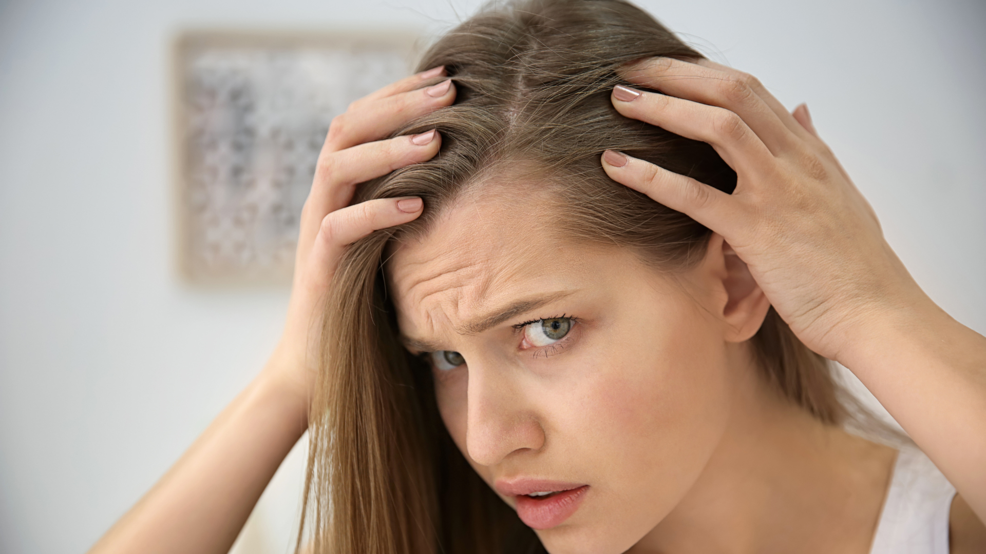 GIRL-LOOKING-AT-PART-WONDERING-WHY-ONE-SIDE-OF-HER-HAIR-IS-THINNER-THAN-THE-OTHER